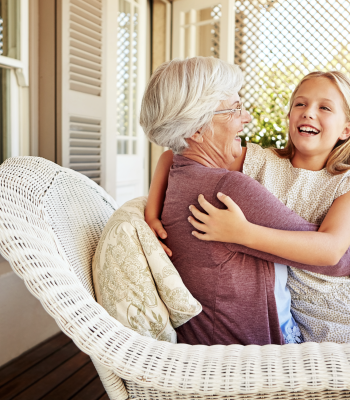 Happy Grandmother with Grandchild on Porch